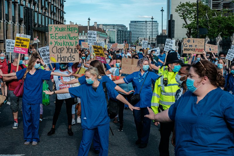 Nurses and hospital staff protesting